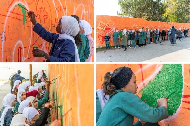 طالبات "أونروا" يرسمن جداريات بمخيم جرش رفضاً للعنف ضد النساء