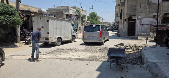 انطلاق حملة لتعبيد الطريق الرئيسية في مخيم النيرب بحلب